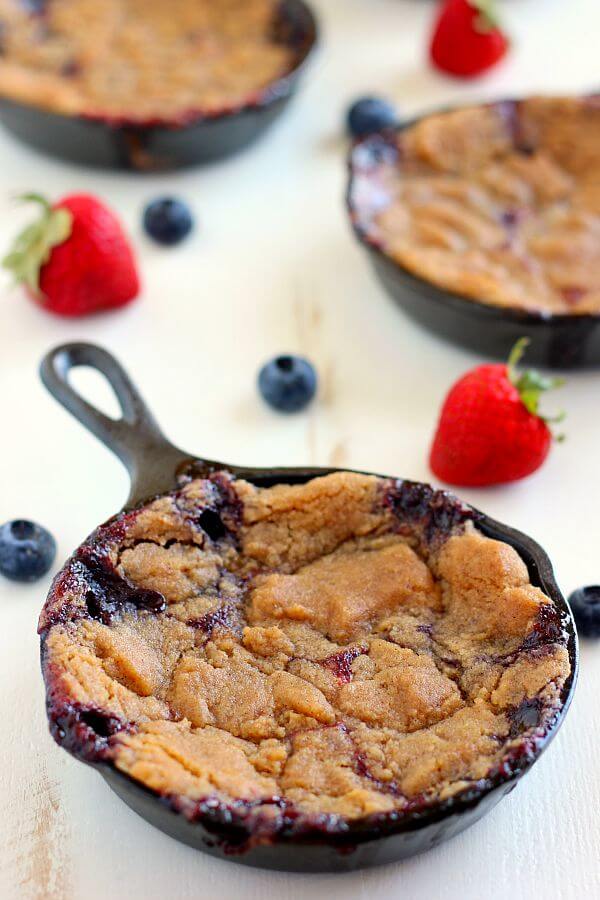 This Berry Skillet Cobbler contains fresh strawberries and juicy blueberries that are combined with a hint of sweetness and baked with a brown sugar topping. It's easy to prepare and is bursting with fresh flavors!