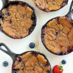 This Berry Skillet Cobbler contains fresh strawberries and juicy blueberries that are combined with a hint of sweetness and baked with a brown sugar topping. It's easy to prepare and is bursting with fresh flavors!