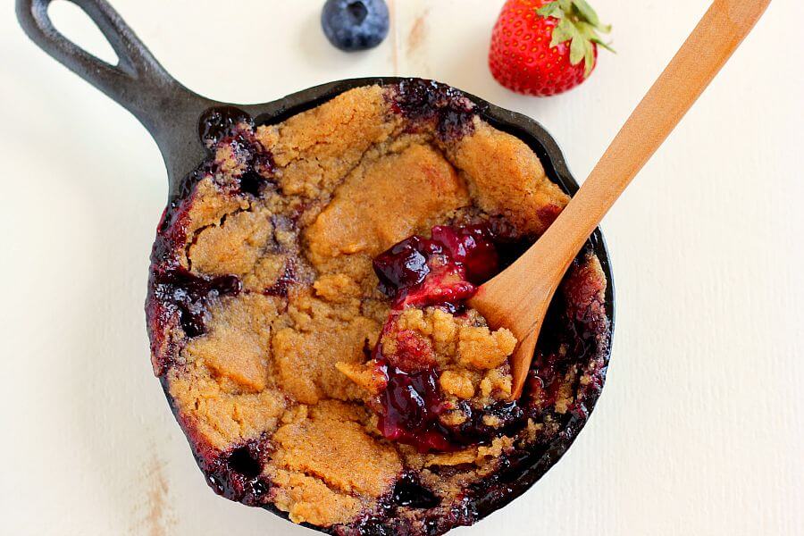 This Berry Skillet Cobbler contains fresh strawberries and juicy blueberries that are combined with a hint of sweetness and baked with a brown sugar topping. It's easy to prepare and is bursting with fresh flavors!