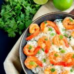 This Honey Garlic Shrimp and Cilantro Lime Rice Bowl is packed with tender shrimp, seasoned with a sweet honey garlic sauce and nestled on top of zesty cilantro lime rice. It's ready in just 20 minutes and bursting with flavor!