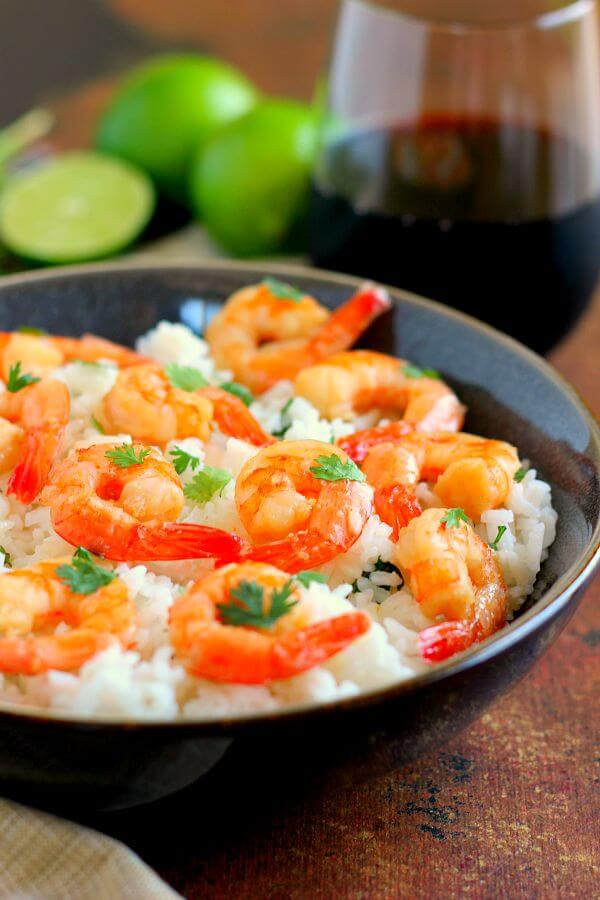 This Honey Garlic Shrimp and Cilantro Lime Rice Bowl is packed with tender shrimp, seasoned with a sweet honey garlic sauce and nestled on top of zesty cilantro lime rice. It's ready in just 20 minutes and bursting with flavor!