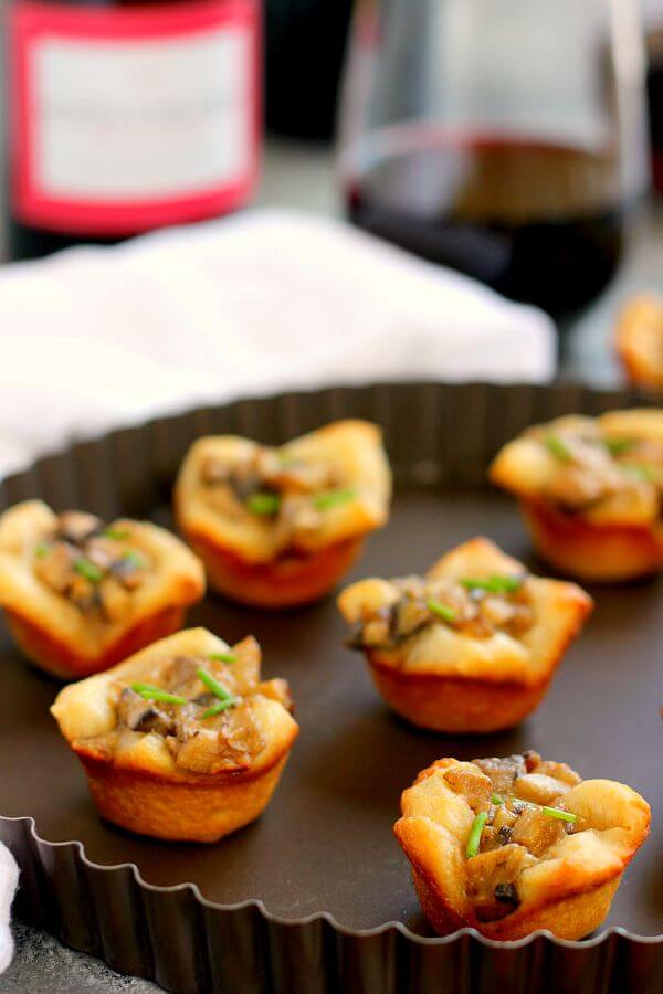 Filled with fresh mushrooms, Parmesan cheese, and a sprinkling of spices, these Parmesan Mushroom Bites are packed with flavor and make the perfect treat for any occasion!