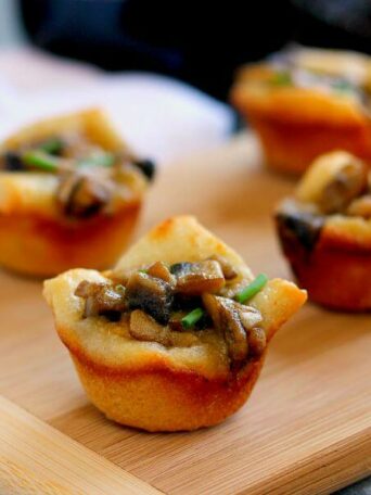 Filled with fresh mushrooms, Parmesan cheese, and a sprinkling of spices, these Parmesan Mushroom Bites are packed with flavor and make the perfect treat for any occasion!