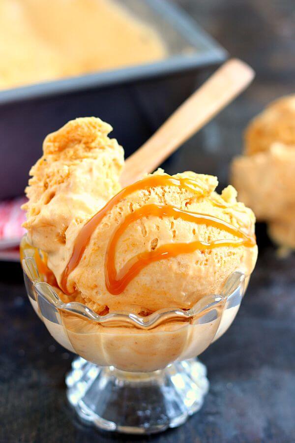 This Pumpkin Caramel Ice Cream is a no-churn recipe and is filled with a smooth pumpkin flavor. It's creamy, swirled with caramel, and so easy to make. If you like pumpkin, then this frozen treat was made for you! #icecream #icecreamrecipe #pumpkinicecream #pumpkinicecreamrecipe #nochurnicecream #nochurnrecipe #caramelicecream #dessert #falldessert #fallrecipe