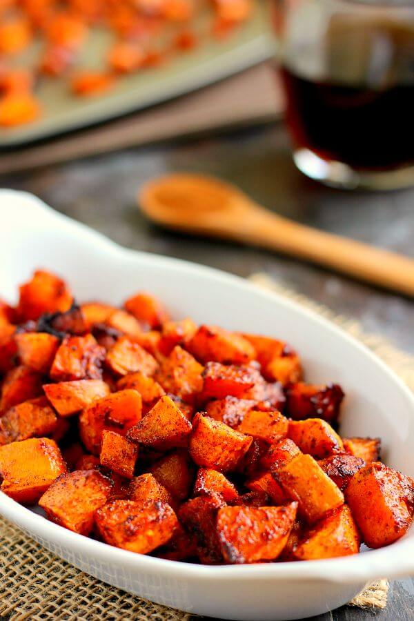 white dish of maple cinnamon sweet potatoes