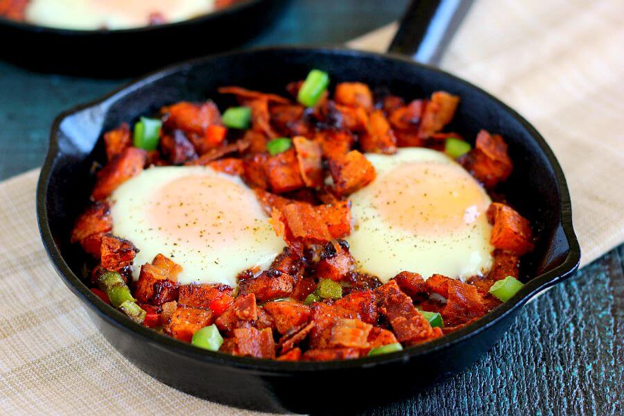 Packed with roasted maple sweet potatoes, fresh eggs, peppers, and bacon, this Roasted Maple Sweet Potato Breakfast Skillet comes together in minutes and makes a hearty breakfast. It's easy to prepare and full of cozy flavors that are perfect on those cool, fall mornings!