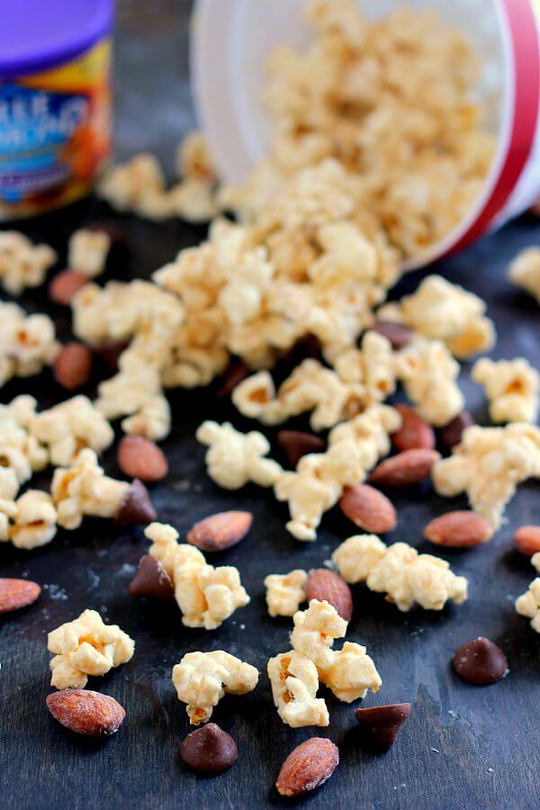Jam-packed with peanut butter popcorn and filled with Blue Diamond Salted Caramel Almonds, this Salted Caramel Peanut Butter Popcorn is a little sweet, a little salty, and the perfect treat to munch on when your cravings strike!