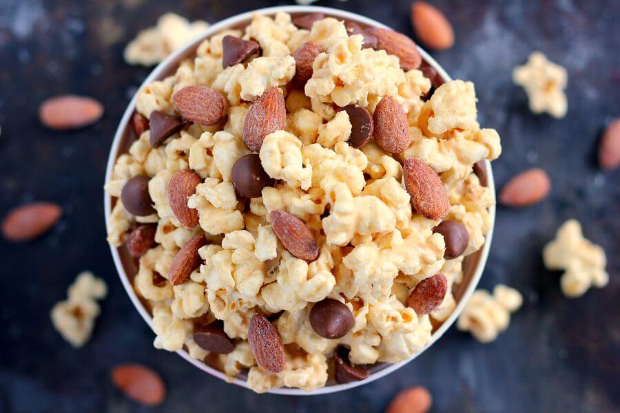 Jam-packed with peanut butter popcorn and filled with Blue Diamond Salted Caramel Almonds, this Salted Caramel Peanut Butter Popcorn is a little sweet, a little salty, and the perfect treat to munch on when your cravings strike!