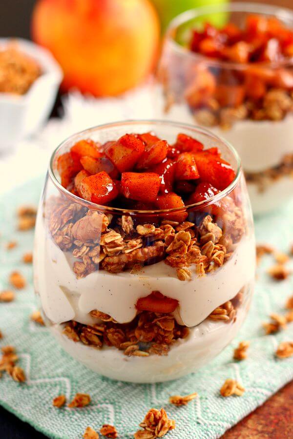 Packed with creamy vanilla yogurt, apple pie granola, and caramelized apples, this Apple Pie Yogurt Parfait is full of protein and fall flavors. It's a great way to spice up your morning breakfast or afternoon snack! #yogurt #yogurtparfait #yogurtrecipes #appleyogurtparfait #applebreakfastrecipes #fallbreakfasts #fallrecipes #recipe