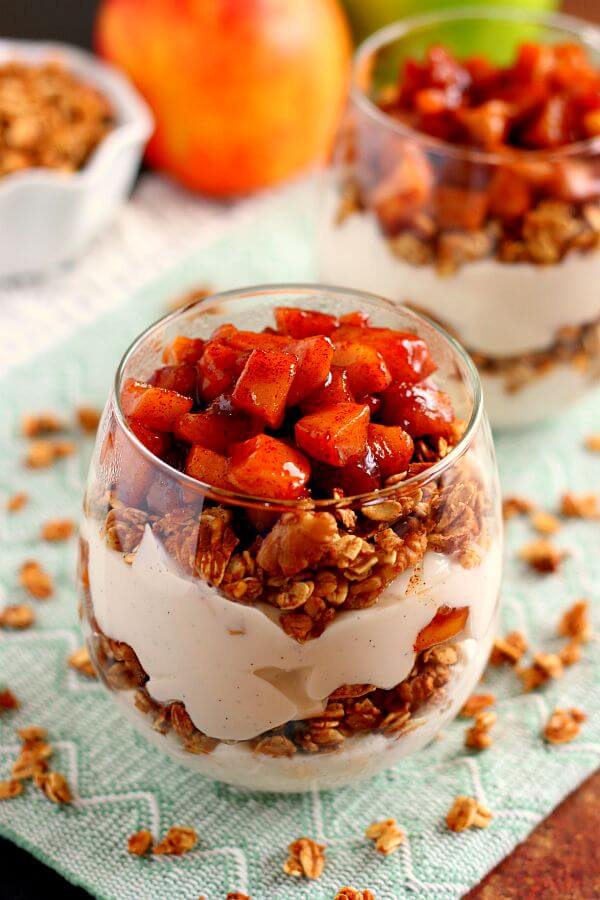 Packed with creamy vanilla yogurt, apple pie granola, and caramelized apples, this Apple Pie Yogurt Parfaitย is full of protein and fall flavors. It's a great way to spice up your morning breakfast or afternoon snack! #yogurt #yogurtparfait #yogurtrecipes #appleyogurtparfait #applebreakfastrecipes #fallbreakfasts #fallrecipes #recipe
