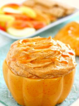 Filled with a cream cheese base and swirled with caramel and pumpkin, this Caramel Pumpkin Cheesecake Dip takes just five minutes to make and captures the flavors of fall. It makes the perfect appetizer or dessert and tastes just like pumpkin cheesecake!
