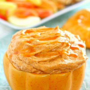 Filled with a cream cheese base and swirled with caramel and pumpkin, this Caramel Pumpkin Cheesecake Dip takes just five minutes to make and captures the flavors of fall. It makes the perfect appetizer or dessert and tastes just like pumpkin cheesecake!