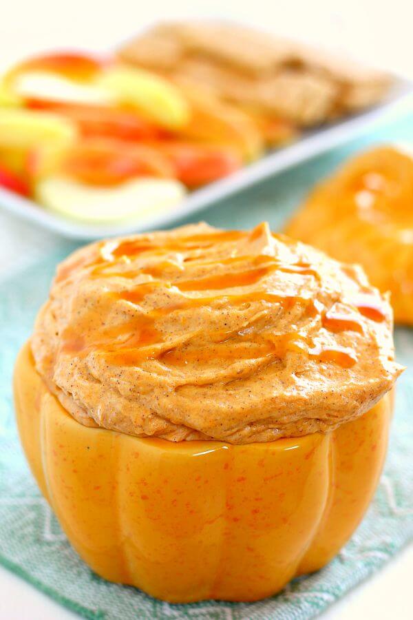 pumpkin cheesecake dip in a pumpkin-shaped serving bowl