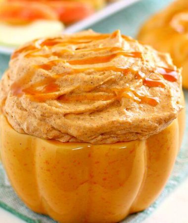 Filled with a cream cheese base and swirled with caramel and pumpkin, this Caramel Pumpkin Cheesecake Dip takes just five minutes to make and captures the flavors of fall. It makes the perfect appetizer or dessert and tastes just like pumpkin cheesecake!
