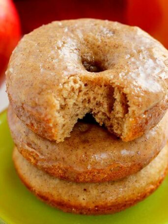 These Cinnamon Vanilla Glazed Donuts are baked to perfection with hints of fall spices and sweet apple cider. Covered in a vanilla glaze that's sweetened with cinnamon, these donuts are easy to make and the perfect treat for fall!