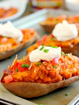 These Loaded Twice Baked Sweet Potatoes make the perfect side dish for any meal. The sweet potatoes are packed with with a brown sugar and cinnamon filling and then topped with cheese, crispy bacon, and sour cream. It's filled with flavor and the perfect fall dish for when you want something warm and comforting!