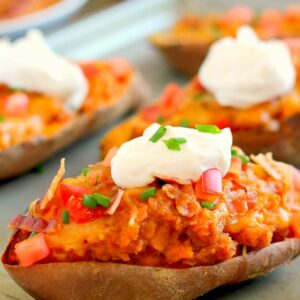 These Loaded Twice Baked Sweet Potatoes make the perfect side dish for any meal. The sweet potatoes are packed with with a brown sugar and cinnamon filling and then topped with cheese, crispy bacon, and sour cream. It's filled with flavor and the perfect fall dish for when you want something warm and comforting!