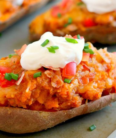 These Loaded Twice Baked Sweet Potatoes make the perfect side dish for any meal. The sweet potatoes are packed with with a brown sugar and cinnamon filling and then topped with cheese, crispy bacon, and sour cream. It's filled with flavor and the perfect fall dish for when you want something warm and comforting!