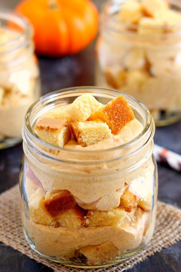 This No-Bake Pumpkin Cheesecake is filled with a creamy cheesecake batter that's swirled with pumpkin and topped with golden pound cake chunks. It's an easy treat that requires no oven and is perfect to capture the flavors of fall! #cheesecake #nobakecheesecake #cheesecakerecipes #pumpkincheesecake #falldesserts #pumpkindessert #recipe