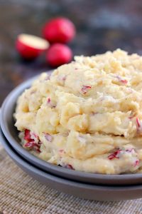 slow cooker garlic parmesan mashed potatoes in a bowl