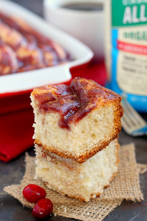 Two slices of cranberry coffee cake, stacked atop each other. 