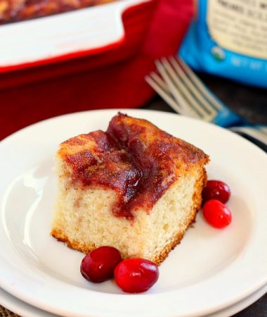 This Cranberry Swirl Coffee Cake is fluffy, moist, and swirled with sweet cranberries. Easy to make and full of flavor, this treat makes the perfect breakfast or dessert for the holiday season!