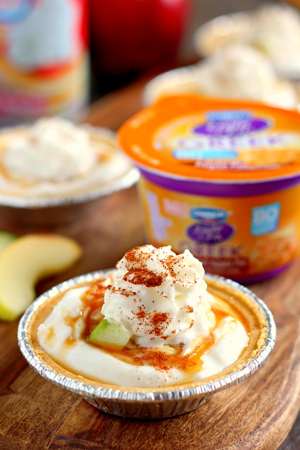 With just a few simple ingredients, these Mini Caramel Apple Yogurt Pies come together in no time and serve as a healthier treat. Filled with sweet yogurt, fresh apple chunks, and a cinnamon swirl, these pies make the perfect fall dessert! #yogurt #yogurtrecipes #caramelapplerecipes #healthybreakfast #healthyrecipes #fallrecipes
