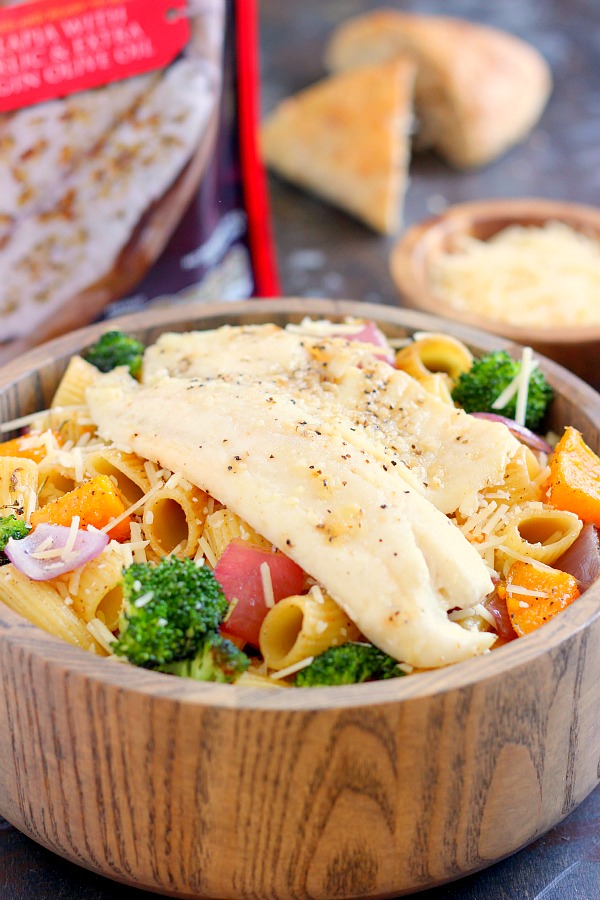 This Tilapia with Roasted Vegetable Pasta features tender rigatoni that is lightly seasoned and filled with fresh, roasted vegetables and topped with flaky tilapia. It's a gourmet meal that can be prepped and ready to eat in just 25 minutes!