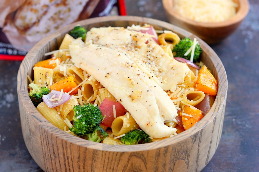 This Tilapia with Roasted Vegetable Pasta features tender rigatoni that is lightly seasoned and filled with fresh, roasted vegetables and topped with flaky tilapia. It's a gourmet meal that can be prepped and ready to eat in just 25 minutes!