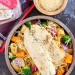 This Tilapia with Roasted Vegetable Pasta features tender rigatoni that is lightly seasoned and filled with fresh, roasted vegetables and topped with flaky tilapia. It's a gourmet meal that can be prepped and ready to eat in just 25 minutes!