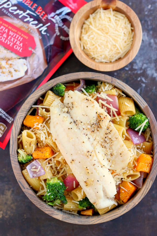 This Tilapia with Roasted Vegetable Pasta features tender rigatoni that is lightly seasoned and filled with fresh, roasted vegetables and topped with flaky tilapia. It's a gourmet meal that can be prepped and ready to eat in just 25 minutes!