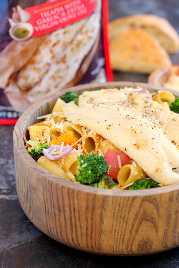 This Tilapia with Roasted Vegetable Pasta features tender rigatoni that is lightly seasoned and filled with fresh, roasted vegetables and topped with flaky tilapia. It's a gourmet meal that can be prepped and ready to eat in just 25 minutes!