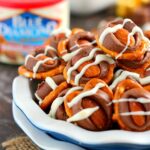 These Almond Pretzel Bites are filled with crunchy pretzels, Smokehouse Almonds, caramel candies, and drizzled with white chocolate. They're ready in minutes and make the perfect game day snack for when you crave a sweet and salty treat!