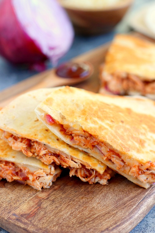 slices of bbq quesadilla on a wood board 