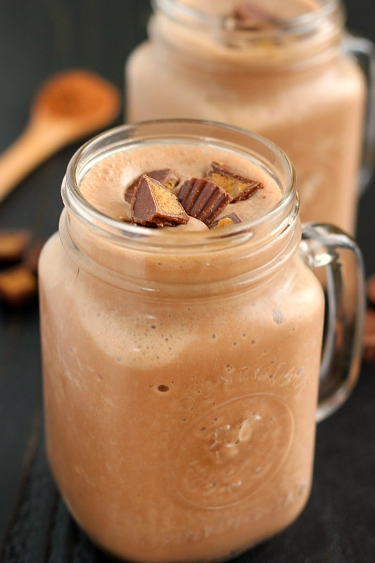 two healthy peanut butter smoothie in glass jars 