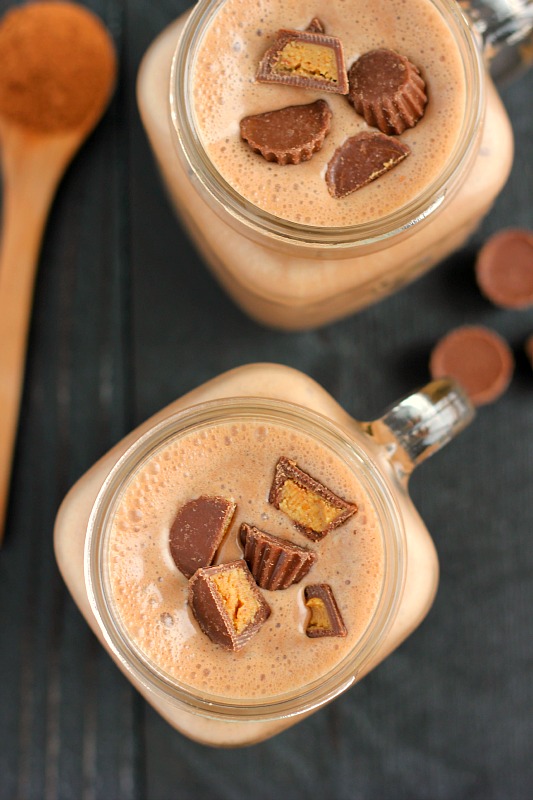 overhead view of two chocolate peanut butter banana smoothies in jars 