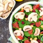 This Cranberry Mushroom Spinach Salad with Lemon Basil Vinaigrette combines baby spinach leaves, dried cranberries, fresh mushrooms, chickpeas, and crumbled bacon, all tossed with a lemon basil dressing. This dish is easy to throw together and serves as the perfect lunch or dinner!