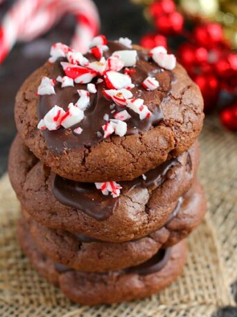 These Peppermint Hot Chocolate Cookies bake up soft, thick and taste just like hot chocolate. The tops are frosted with mint chocolate and then topped with crushed candy canes. These cookies are perfect to enjoy all season long!