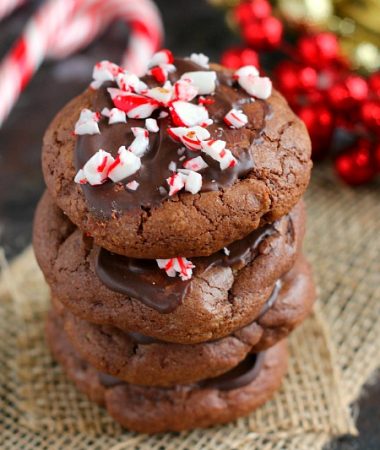 These Peppermint Hot Chocolate Cookies bake up soft, thick and taste just like hot chocolate. The tops are frosted with mint chocolate and then topped with crushed candy canes. These cookies are perfect to enjoy all season long!