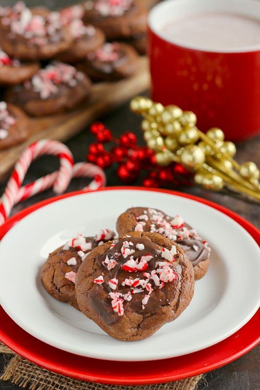 three peppermint hot chocolate cookies on a white plate 