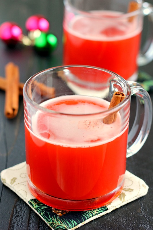 This Spiced Cherry Cider is filled with sweet apple cider and spiced with cinnamon and cherry gelatin. It's simmered until the flavors are blended together and makes the perfect drink for when you need a little warming up! #cider #ciderrecipe #cherrycider #cherrydrink #holidaybeverage #holidaydrink #christmasdrink #drink