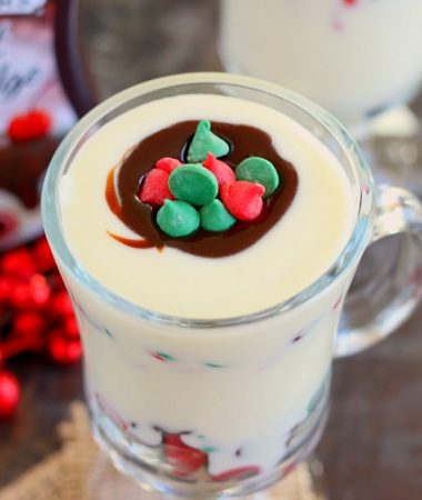 This White Chocolate Fudge Pudding is creamy, rich, and bursting with flavor. White chocolate pudding is layered with hot fudge and festive chocolate chips. It's easy to make and so much better than the store-bought kind. If you're looking for a new dessert for the holiday season, then this pudding is guaranteed to be a favorite!