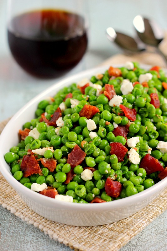 These Bacon and Feta Peas are seasoned with a buttery garlic sauced and packed with crumbled bacon and creamy feta cheese. It’s an easy side dish that takes just minutes to make and is sure to be a favorite in your household!