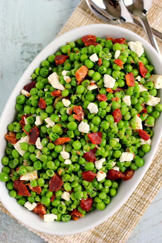 These Bacon and Feta Peas are seasoned with a buttery garlic sauced and packed with crumbled bacon and creamy feta cheese. It’s an easy side dish that takes just minutes to make and is sure to be a favorite in your household!