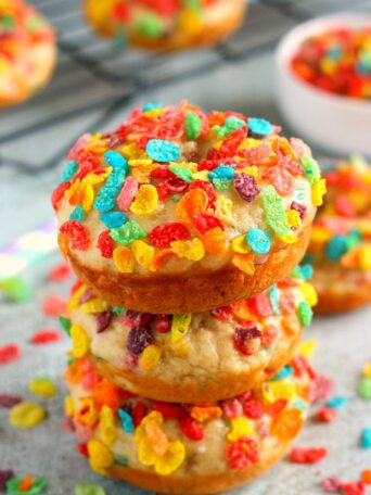 These Baked Fruity Pebble Donuts feature a fluffy vanilla batter, packed with sweet Fruity Pebbles. The donuts are baked and then topped with a rich, vanilla glaze. Healthier than the fried kind and so delicious, these treats will bring out the kid inside of you!