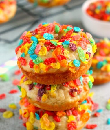 These Baked Fruity Pebble Donuts feature a fluffy vanilla batter, packed with sweet Fruity Pebbles. The donuts are baked and then topped with a rich, vanilla glaze. Healthier than the fried kind and so delicious, these treats will bring out the kid inside of you!