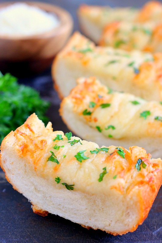 close up of slices of cheesy garlic bread