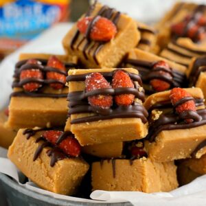 This Honey Roasted Peanut Butter Fudge is smooth, creamy, and filled with a rich peanut butter taste. Topped with Blue Diamond Honey Roasted Almonds and a drizzle of dark chocolate, this easy treat comes together in minutes and is sure to be the perfect dessert for your next party or get-together!