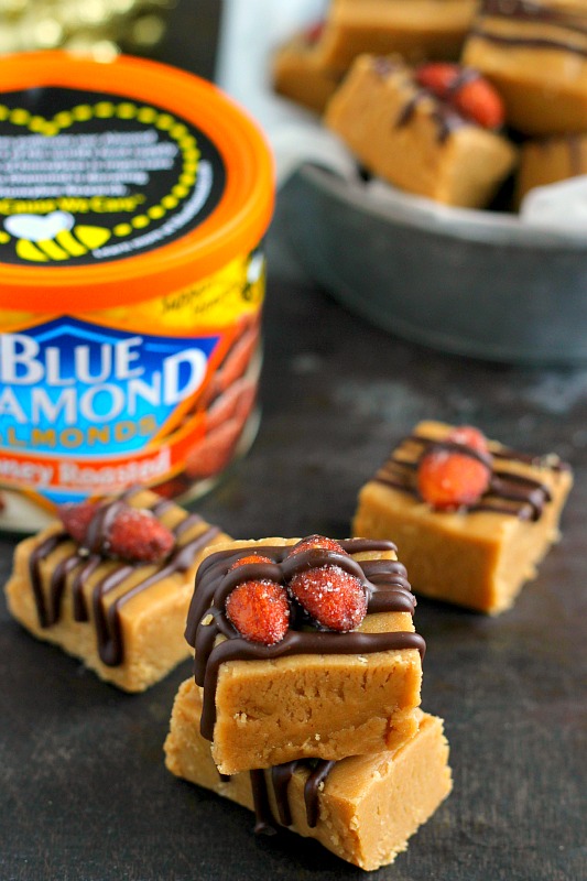 This Honey Roasted Peanut Butter Fudge is smooth, creamy, and filled with a rich peanut butter taste. Topped with Blue Diamond Honey Roasted Almonds and a drizzle of dark chocolate, this easy treat comes together in minutes and is sure to be the perfect dessert for your next party or get-together!