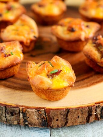 These Mini Sausage Quiches make a delicious, savory dish for your next breakfast or brunch. Filled with zesty sausage, mozzarella cheese and eggs, this recipe is perfect to satisfy your breakfast cravings!